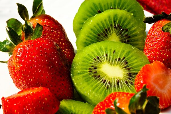 Kiwi and strawberry on a white background