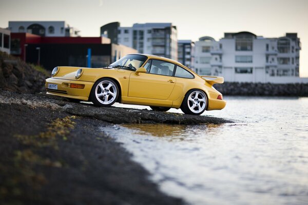 An overloaded car in a yellow body