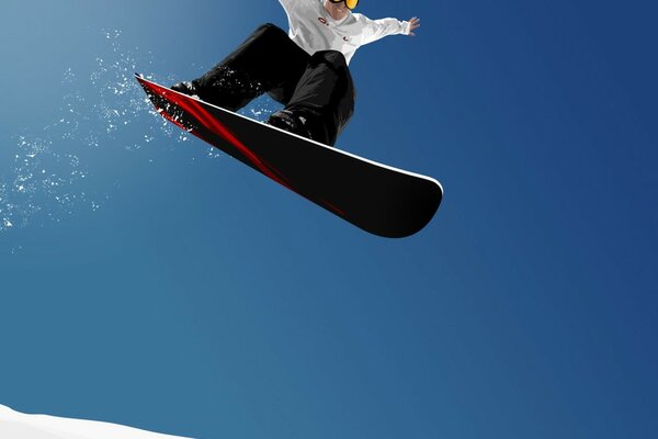 Vol d un homme sur un snowboard en hiver