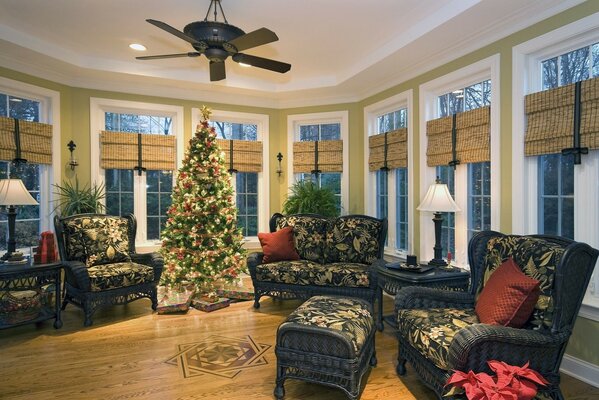 Living room with upholstered furniture and a beautiful Christmas tree