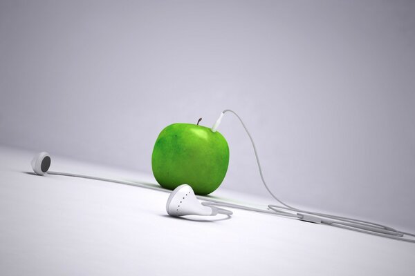 The headphones are connected to an apple on the surface