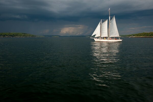 A small ship with full sails