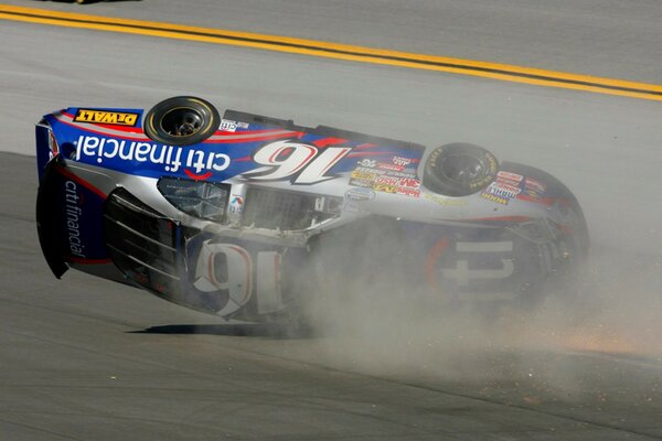 Image of a nascar car racing accident