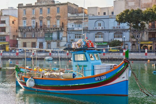 Floating boat on the river in the town