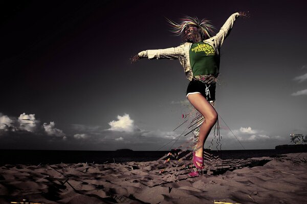 Girl dancing on the sand