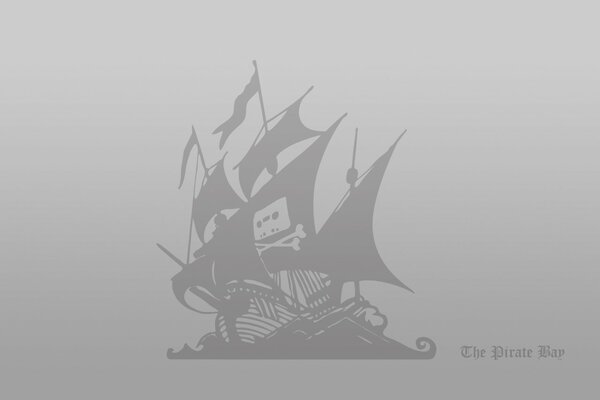A pirate ship is sailing on a gray background