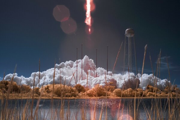 Raketenstart am Teich mit Gras