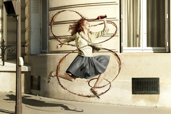 Girl with a drink running