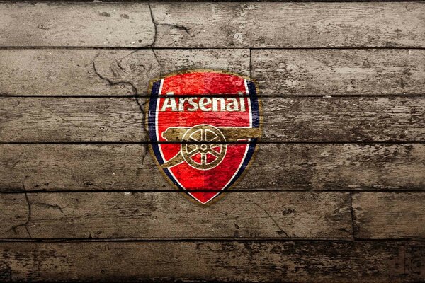 Emblème de l Arsenal sur fond en bois