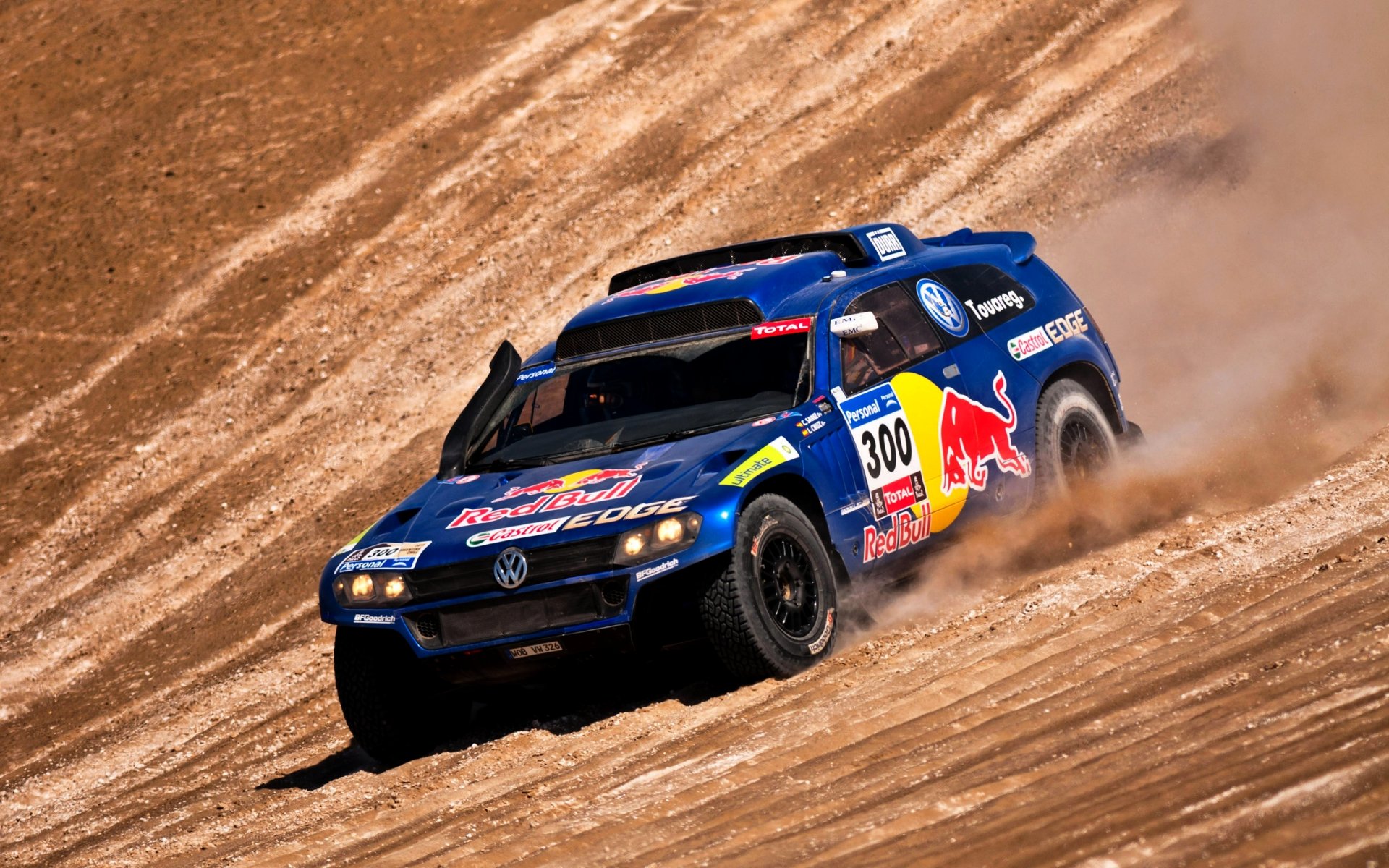 volkswagen tuareg blu dakar rally vista laterale toro rosso suv rally giorno fari