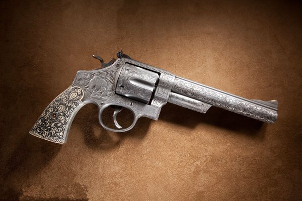 Antique grey revolver with engraving