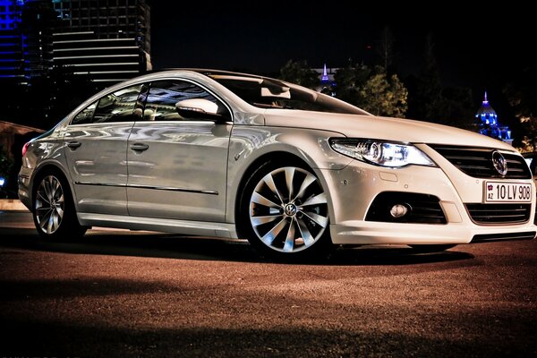 White Volkswagen Passat on the evening street