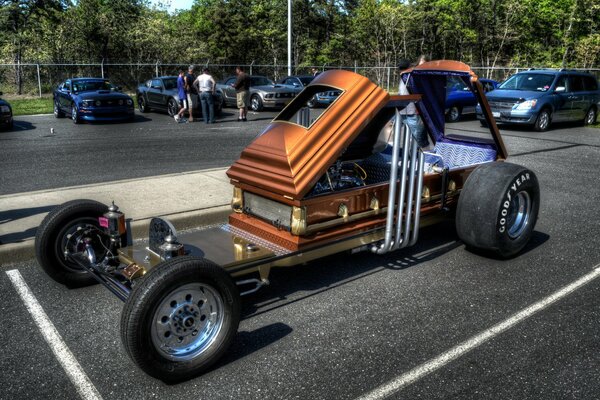 Homemade car from a coffin in the parking lot