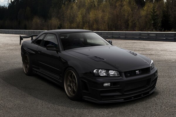 Nissan gtr34 black outdoors