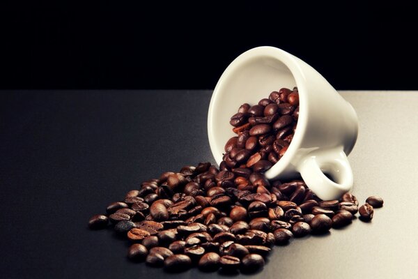 Coffee beans in a cup on the table