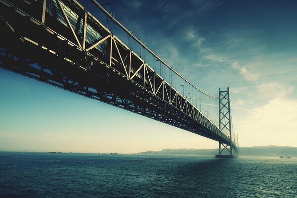 Bridge across the strait, going into the clouds