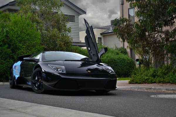 Black lamborghini with open door