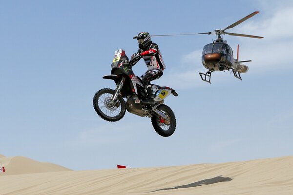 Motorcycle and helicopter for one joint picture