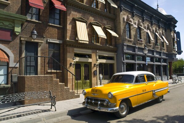 Taxi passing between houses