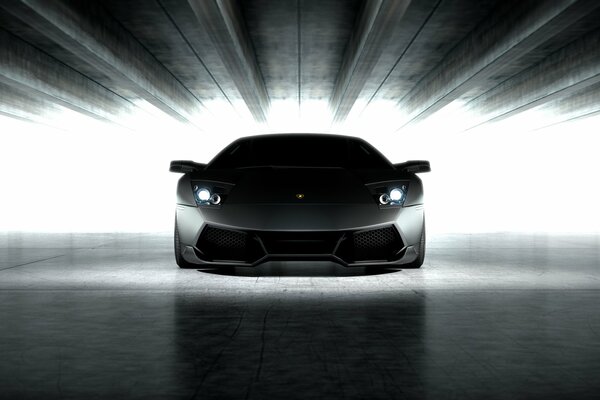 Lamborghini black matte with headlights on