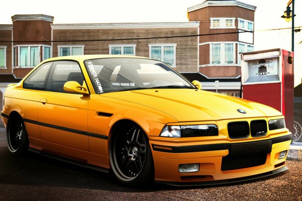 Yellow BMW tuned with lowered suspension