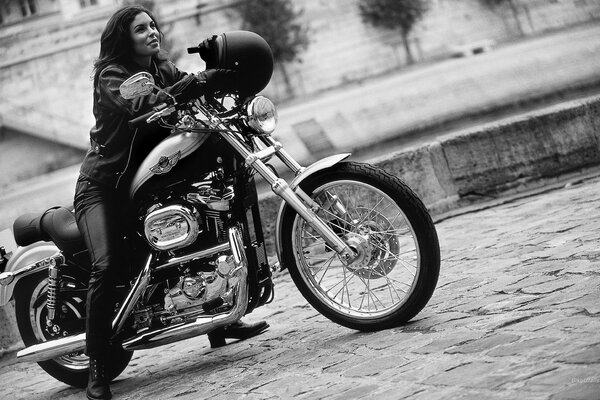 Black and white photo of a motorcyclist girl