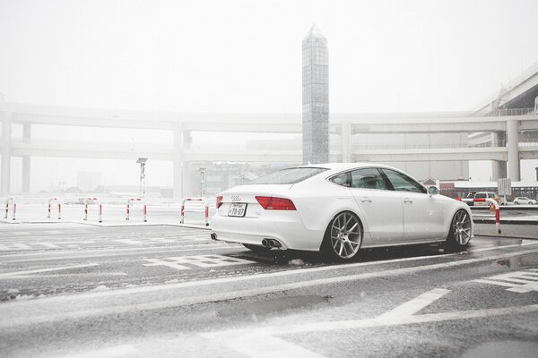 White audi a7 rides in the snow