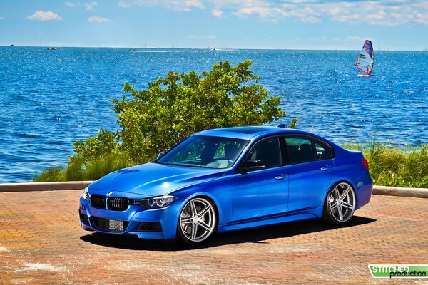 Blue car on the background of the sea. Bmw