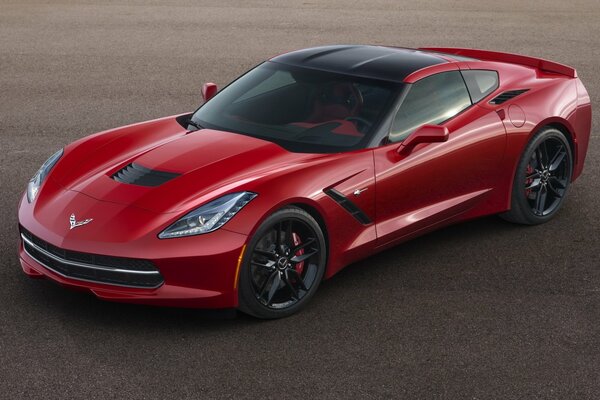A chic red Chevrolet Corvette with aggressive contours