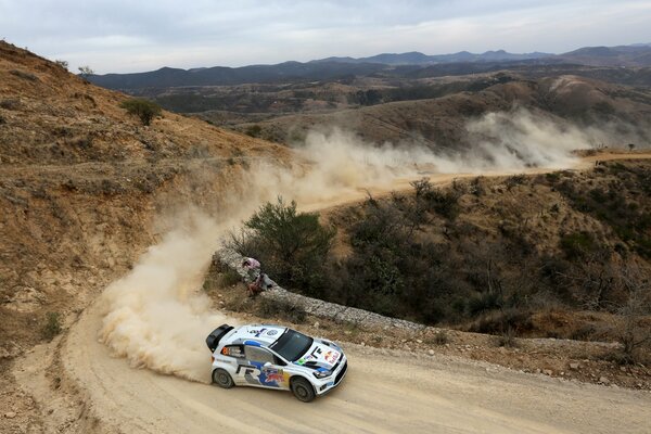 Sporty volkswagen on a dusty road