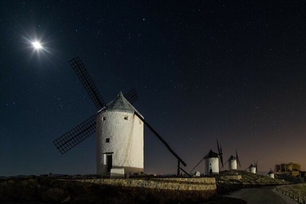 Windmills at night against the starry sky