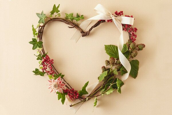 Beautiful wreath in the form of a heart of flowers