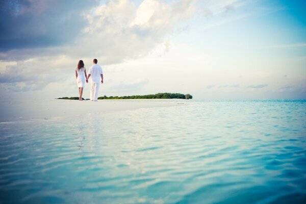 Two lovers on the sea beach