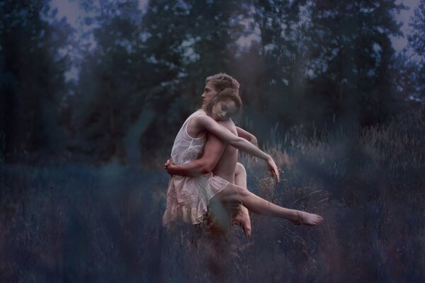 Young couple on the night field