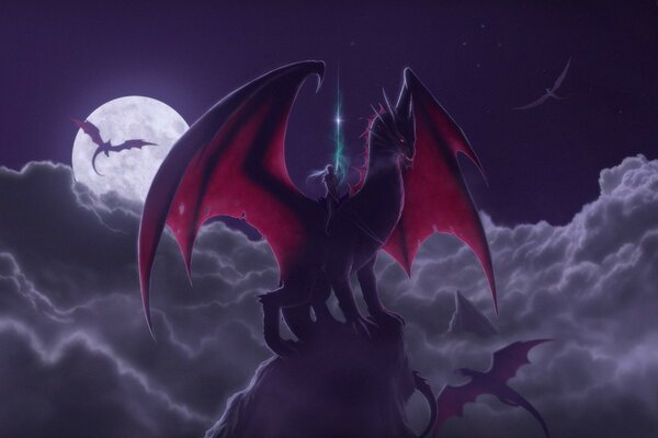 Fantasy. Night. Moon. The rider saddled the dragon