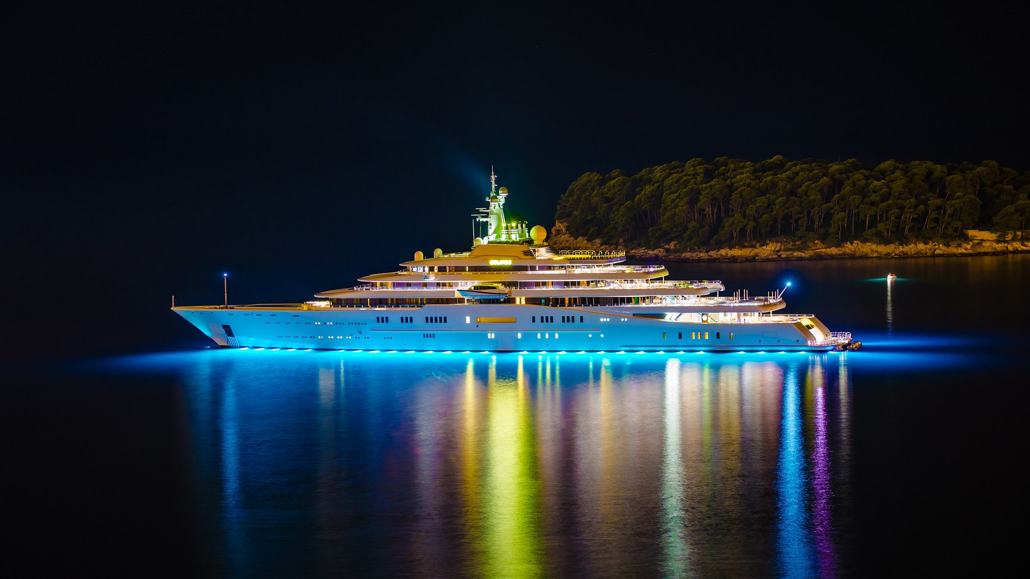 luxury mega yacht eclipse lights night island trees