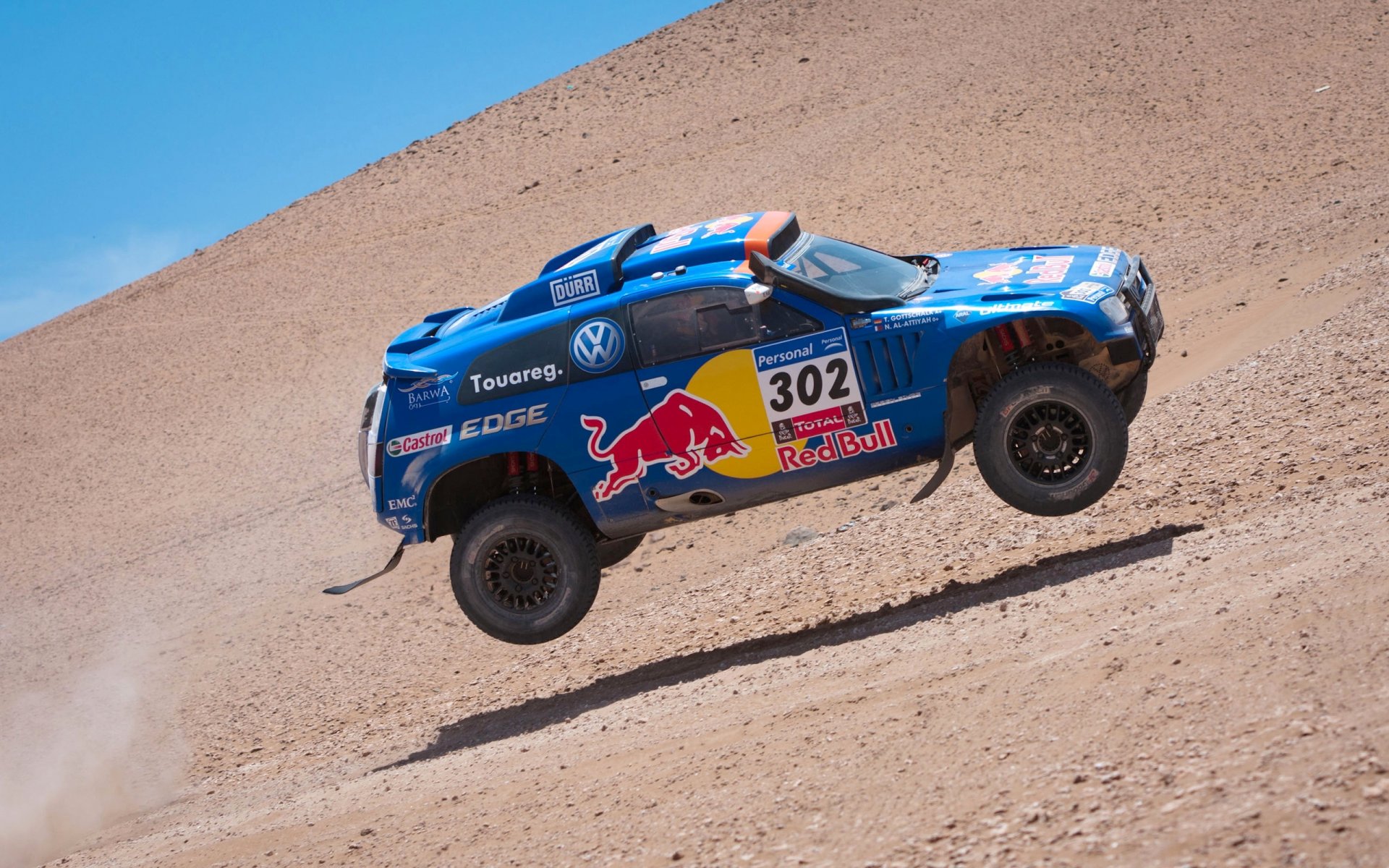 volkswagen touareg blue dakar rally tuareg in the air speed red bull race