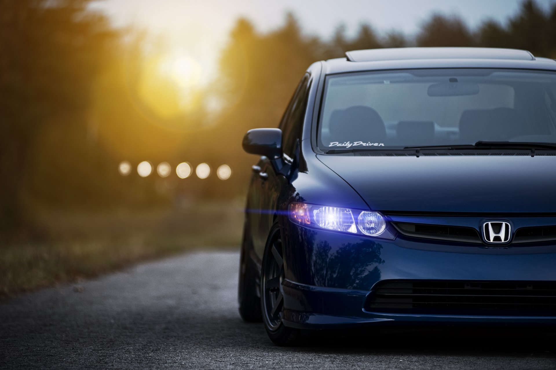 honda civic sedan blue front honda civic sunset sun glare