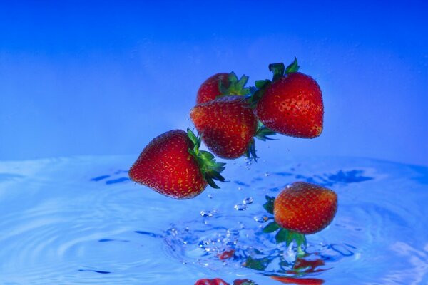 Strawberries over water