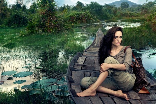 Angelina Jolie poses in a boat