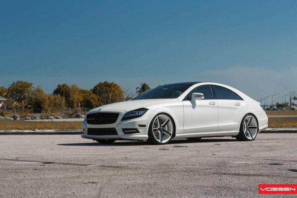 White mercedes benz cls parked on the asphalt