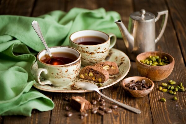 Sponge cake with pistachios tea and chocolate