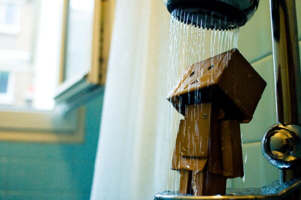 Sad robot takes a shower