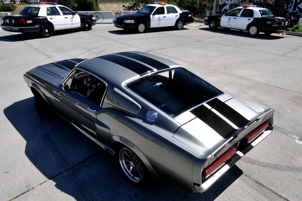 Ford Mustang and police cars