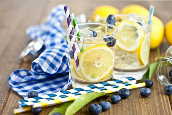 Blueberries and lemon in an ice cocktail