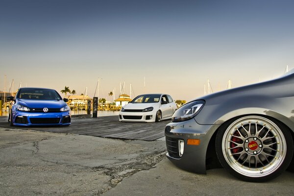 Three Volkswagen cars in the parking lot