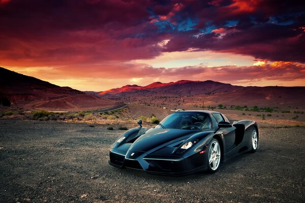 Ferrari enzo in the desert at red sunset