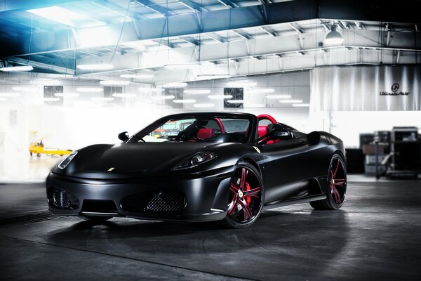 Black Ferrari supercar tuning in the garage