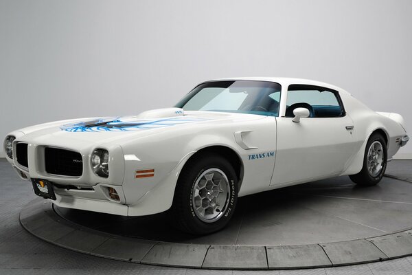 A white 1973 pontiac trans am car