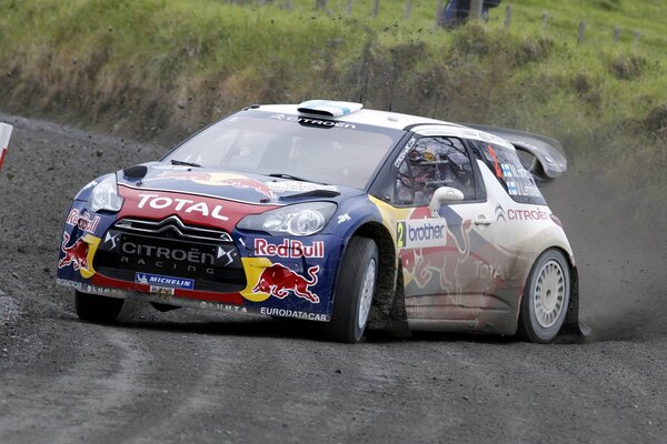 Photo of citroen skidding on a rally on a dirt road